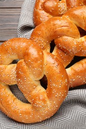 Photo of Tasty freshly baked pretzels on table, above view