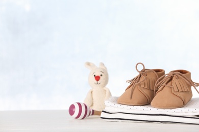 Photo of Set with baby accessories on table against light background, space for text