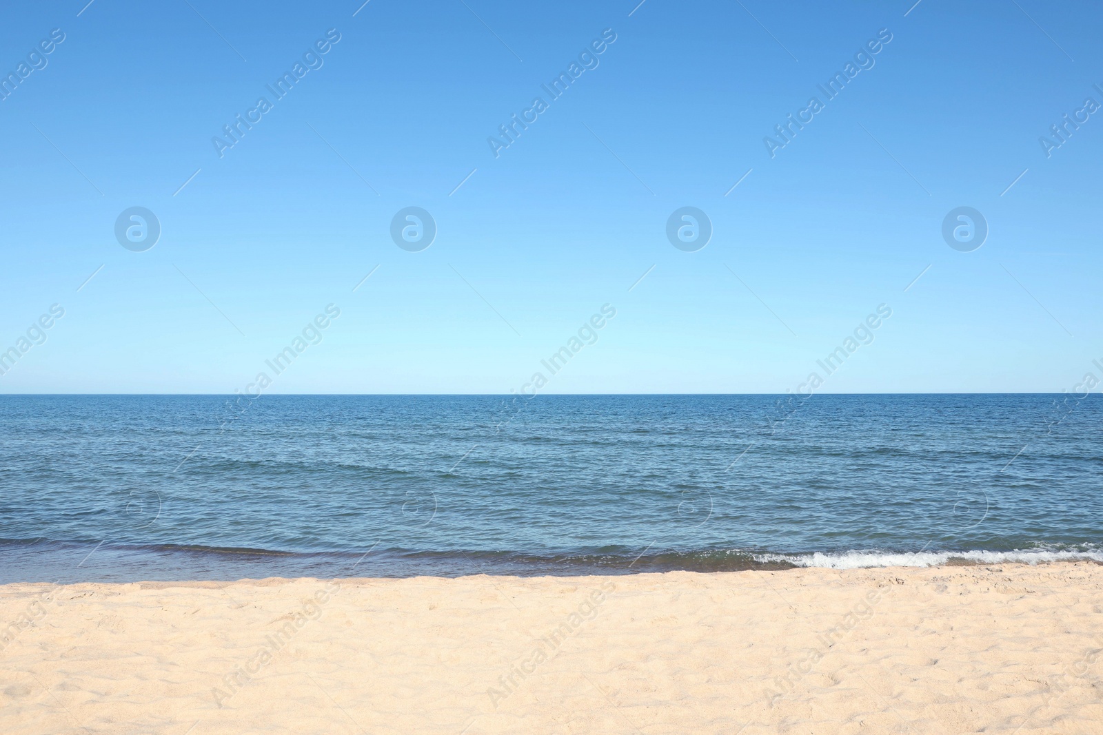 Photo of Picturesque view of sandy beach near sea