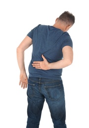 Man suffering from back pain on white background