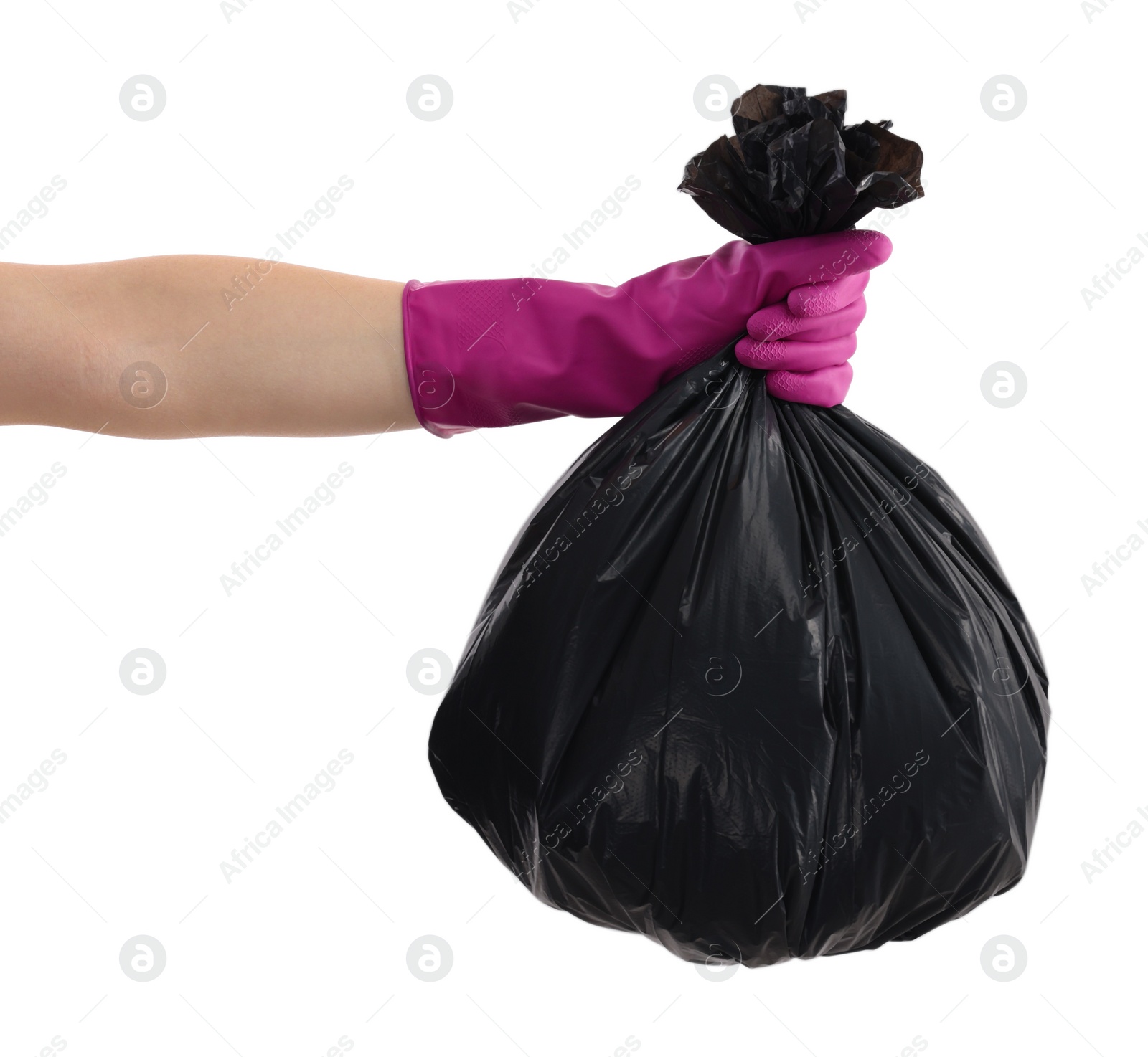 Photo of Woman holding plastic bag full of garbage on white background, closeup