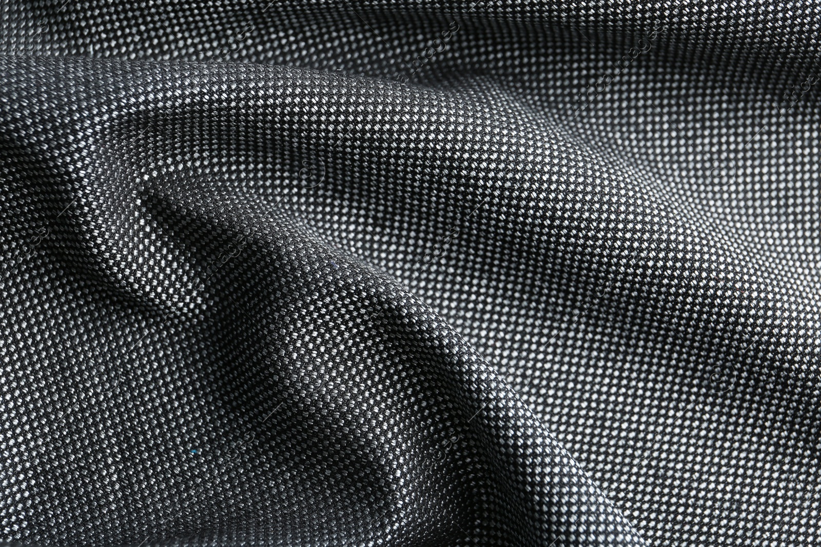 Photo of Texture of dark fabric as background, closeup