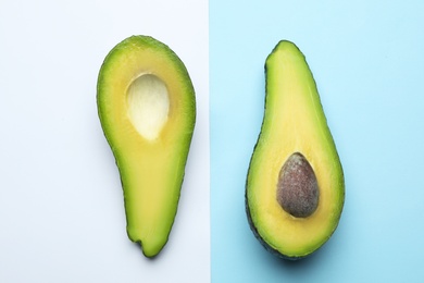 Flat lay composition with fresh ripe avocado on color background