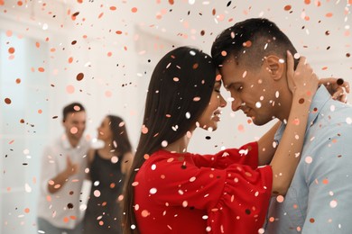 Lovely young couple dancing together at party