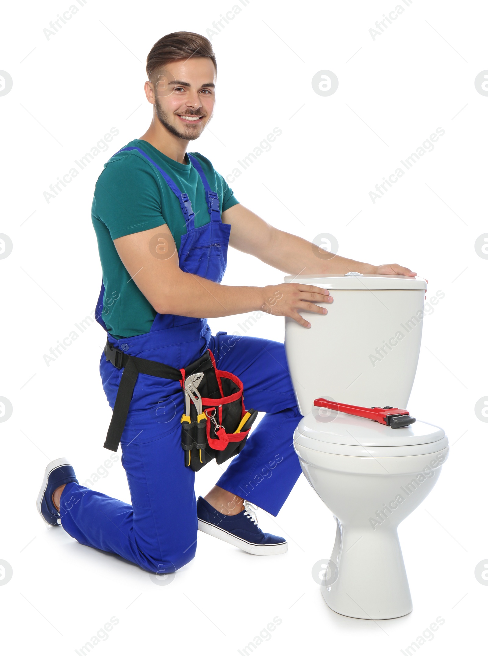 Photo of Young man working with toilet tank, isolated on white