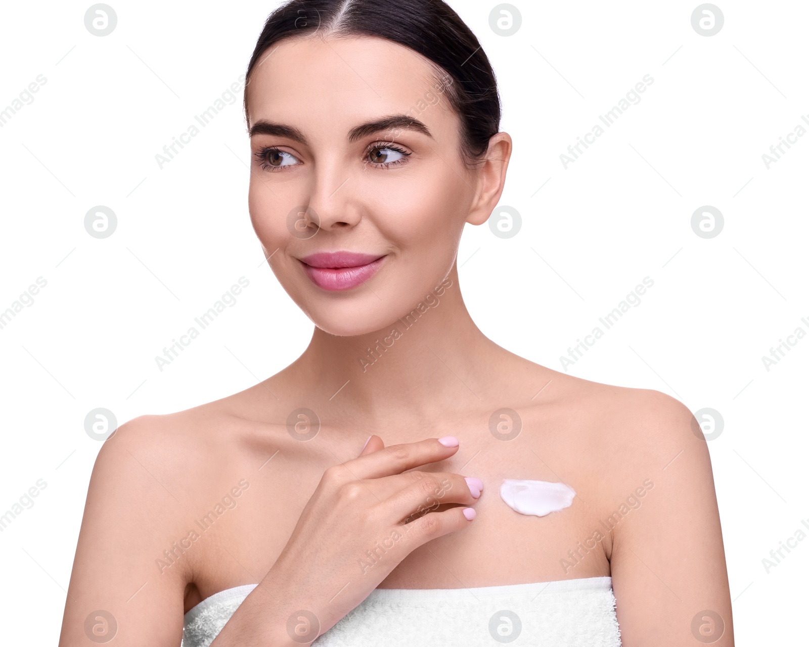 Photo of Beautiful woman with smear of body cream on her chest against white background