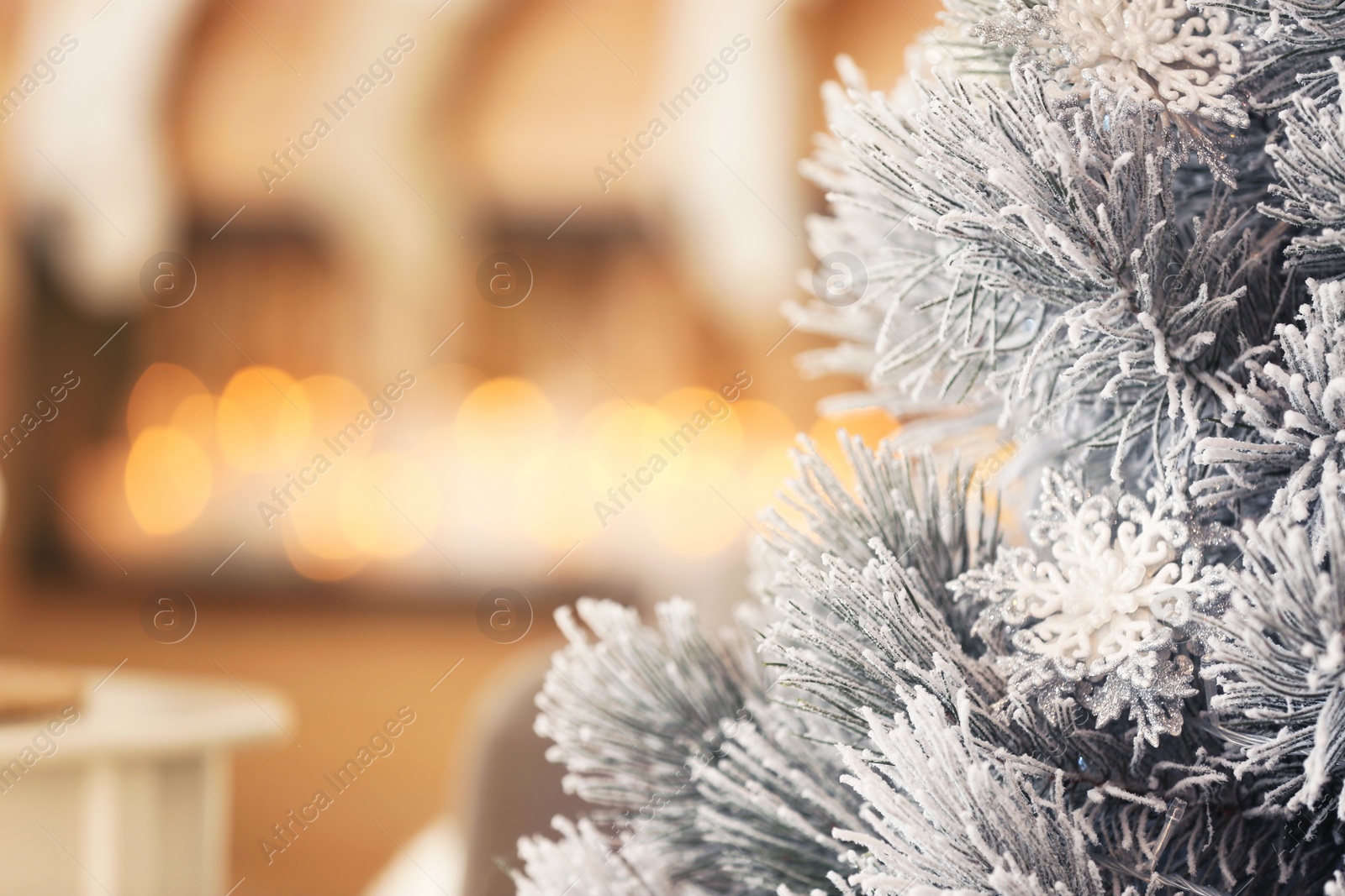 Photo of Beautiful decorated Christmas tree  against blurred festive lights, closeup