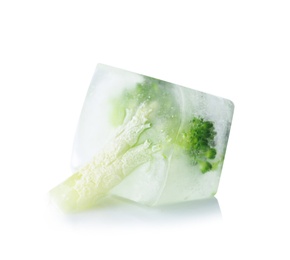 Photo of Fresh broccoli in ice cube on white background. Frozen vegetables