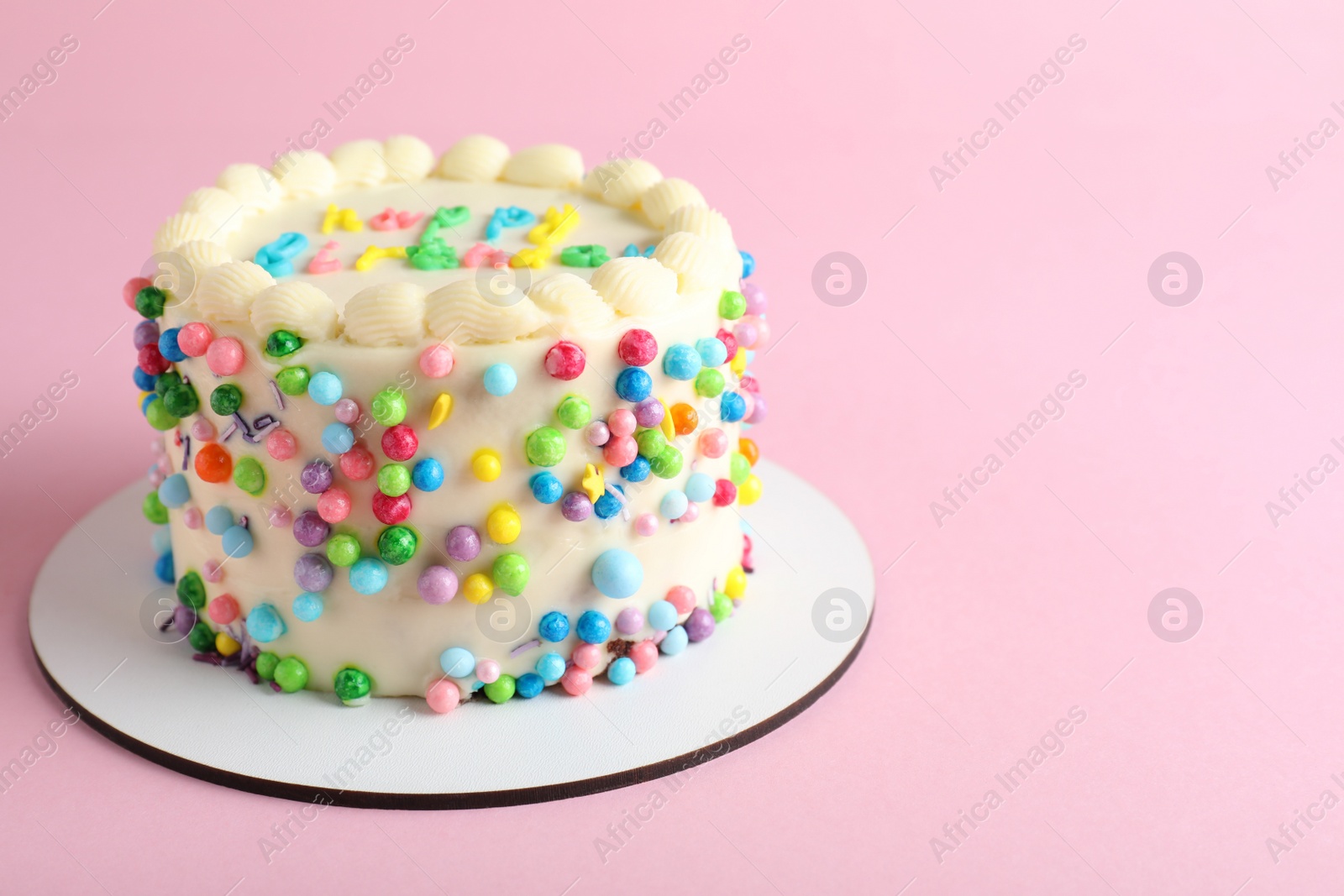 Photo of Cute bento cake with tasty cream on pink background, space for text