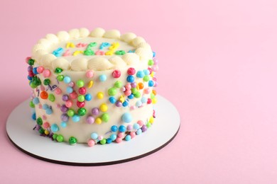 Photo of Cute bento cake with tasty cream on pink background, space for text