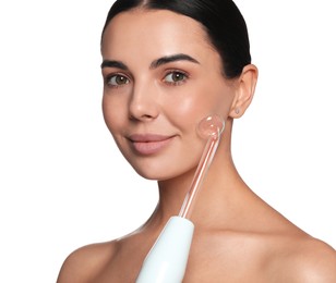 Woman using high frequency darsonval device on white background