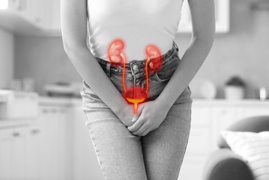 Image of Woman suffering from cystitis at home, closeup. Illustration of urinary system