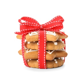 Tasty homemade Christmas cookies tied with ribbon on white background