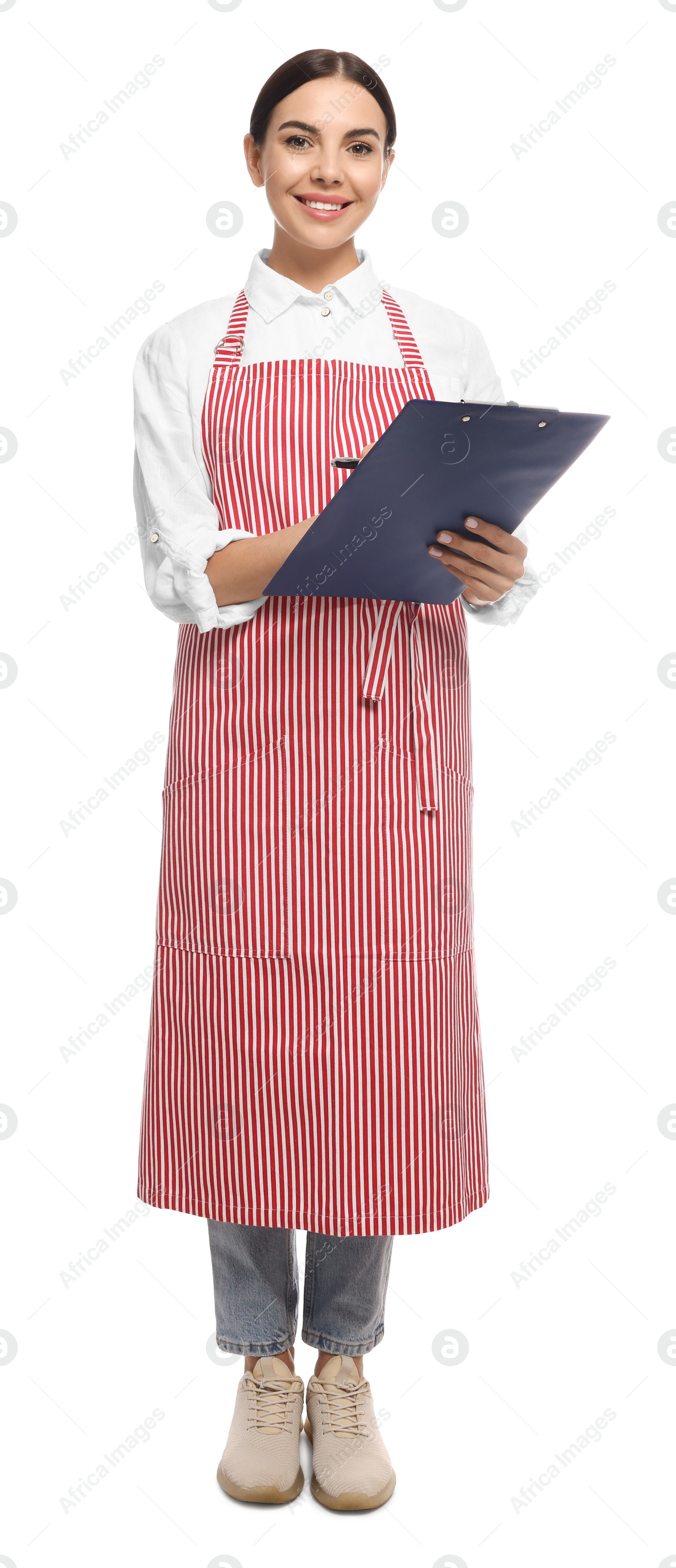 Photo of Young woman in red striped apron with clipboard on white background