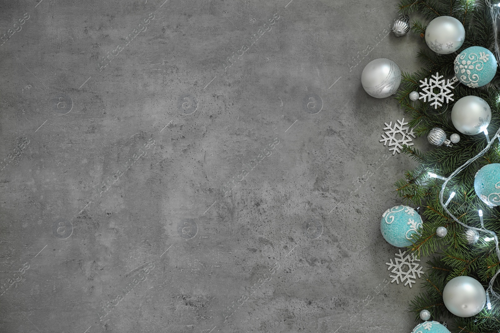 Photo of Christmas decoration on stone background, flat lay. Space for text