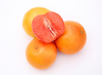 Photo of Fresh grapefruits on white background, above view
