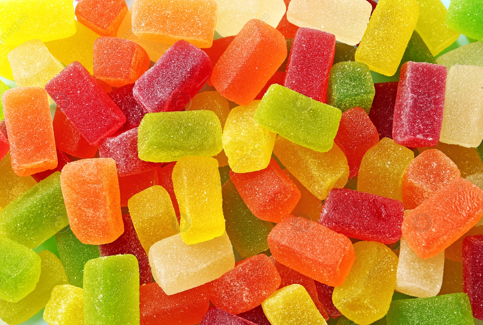 Photo of Different colorful sweet jelly candies, top view