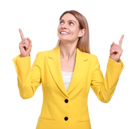 Photo of Beautiful happy businesswoman pointing at something on white background