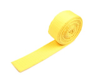 Photo of Yellow karate belt isolated on white. Martial arts uniform