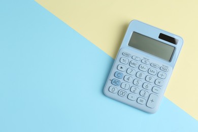 Modern calculator on color background, top view. Space for text