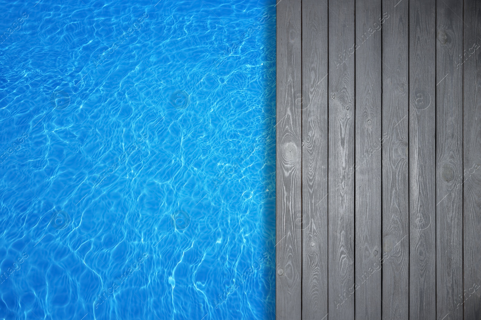 Image of Empty grey wooden surface near swimming pool with clear water, top view. Space for design