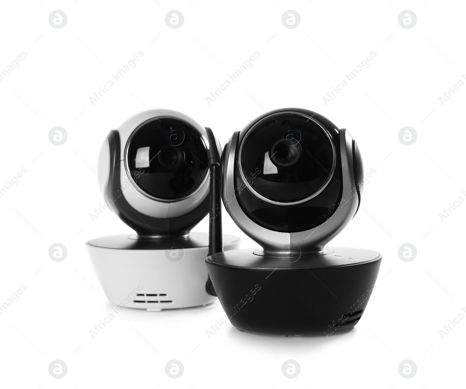 Photo of Modern CCTV security cameras on white background