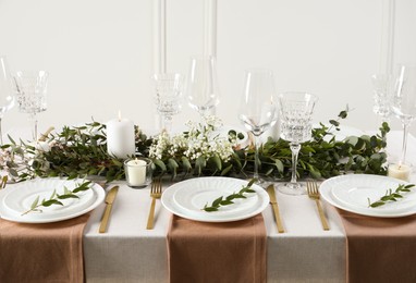 Stylish elegant table setting for festive dinner indoors