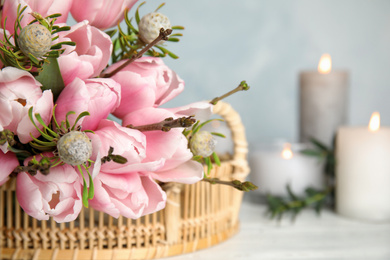 Photo of Beautiful bouquet with spring pink tulips on table, closeup