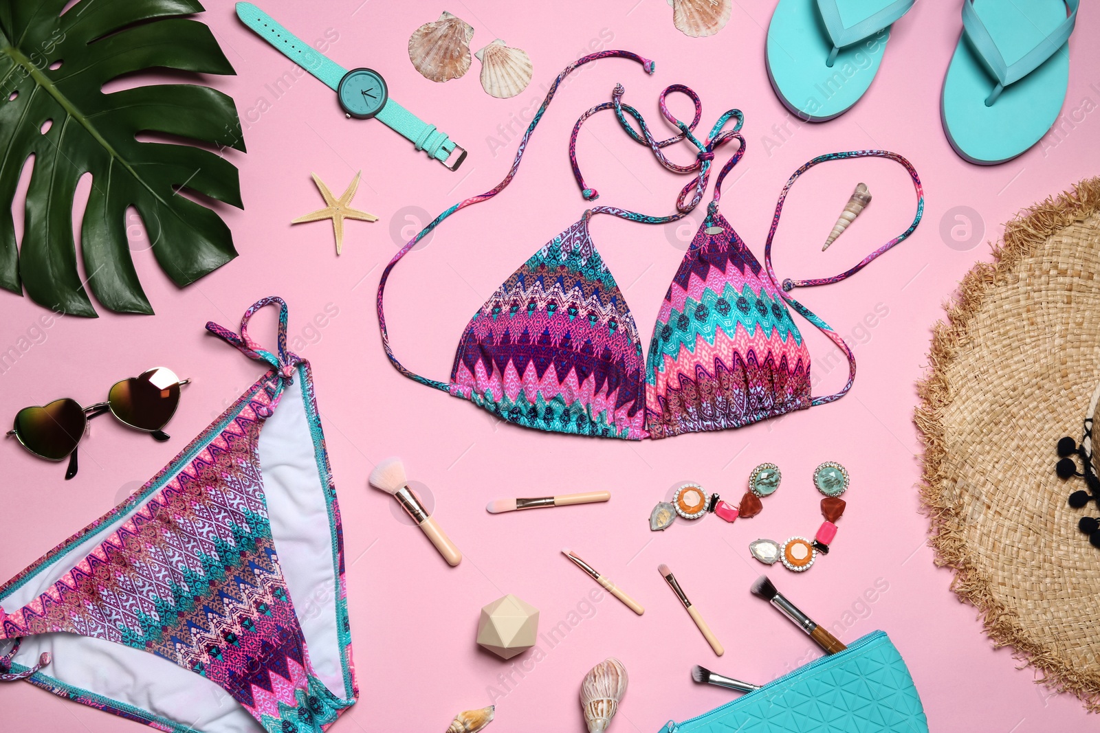 Photo of Flat lay composition with stylish bikini on color background