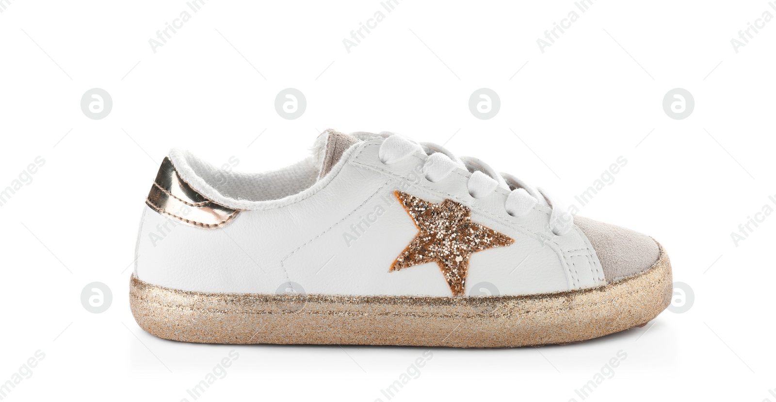 Photo of Stylish new shoe with sparkles on white background