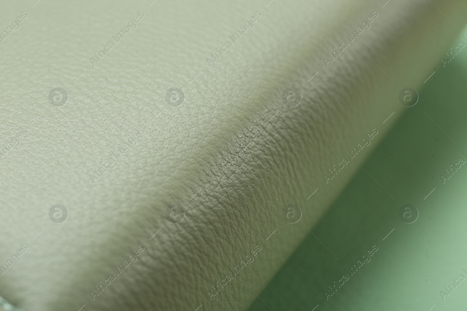 Photo of Beautiful green leather on table, closeup view