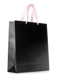 Photo of Paper shopping bag isolated on white. Mock up for design