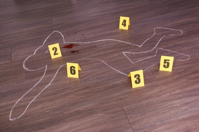 Crime scene with chalk outline of human body, blood, bullet shells and evidence markers on wooden floor. Detective investigation