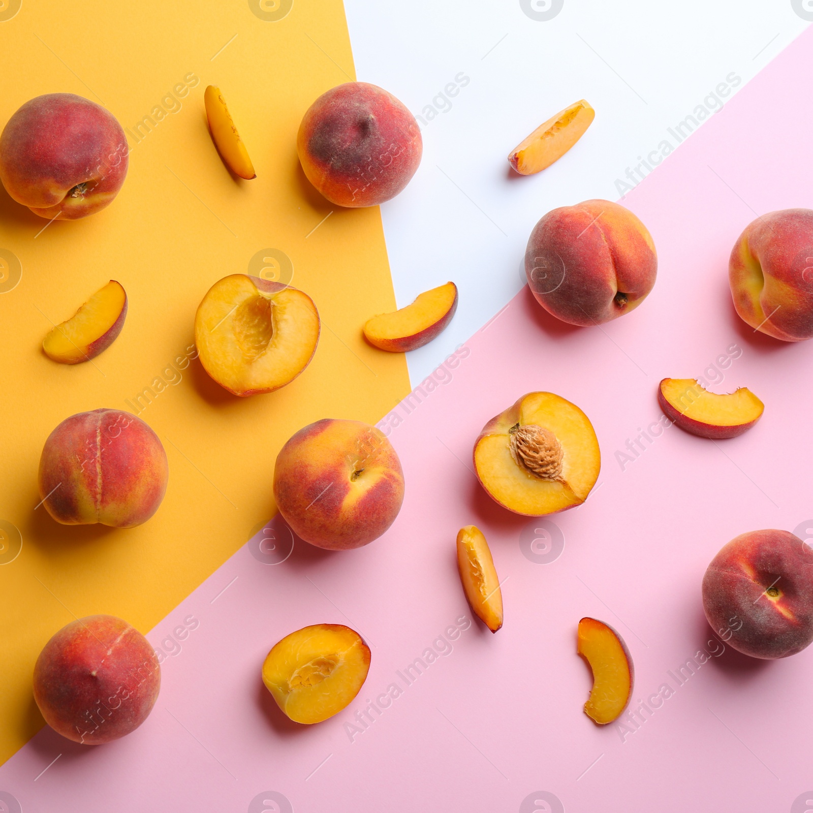 Photo of Flat lay composition with fresh peaches on color background