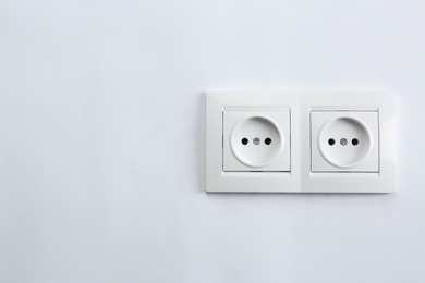 Photo of Power sockets on white background. Electrician's equipment