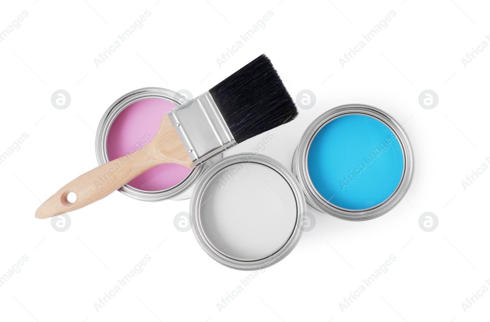 Photo of Cans with different paints and brush on white background, top view