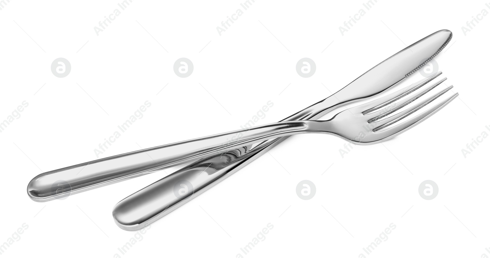 Photo of Fork and knife isolated on white. Stylish shiny cutlery set