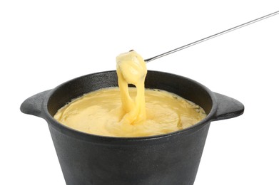 Photo of Dipping piece of bread into fondue pot with tasty melted cheese isolated on white