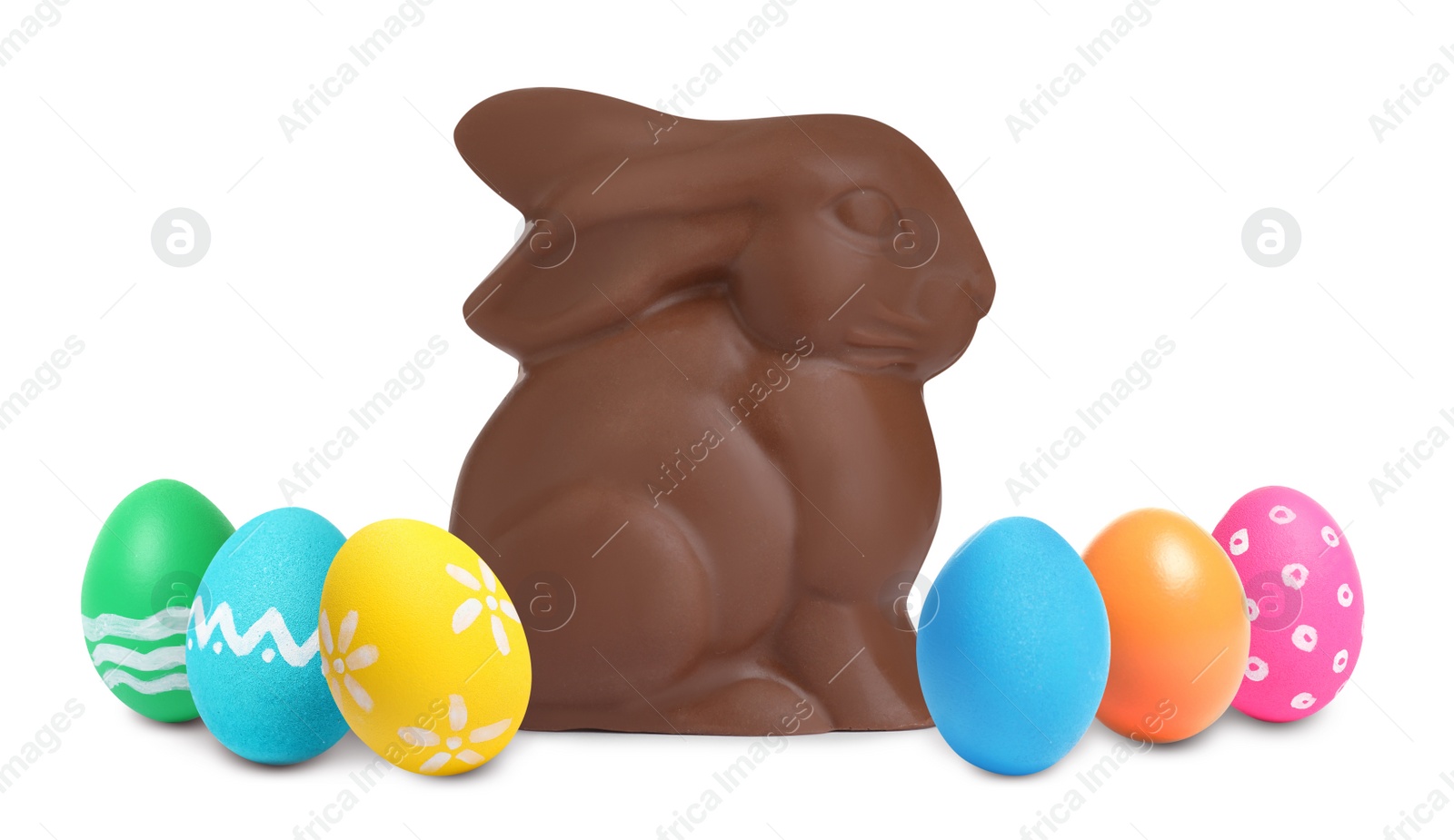 Image of Chocolate bunny and painted Easter eggs on white background