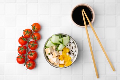 Delicious poke bowl with meat, rice and vegetables served on white table, flat lay