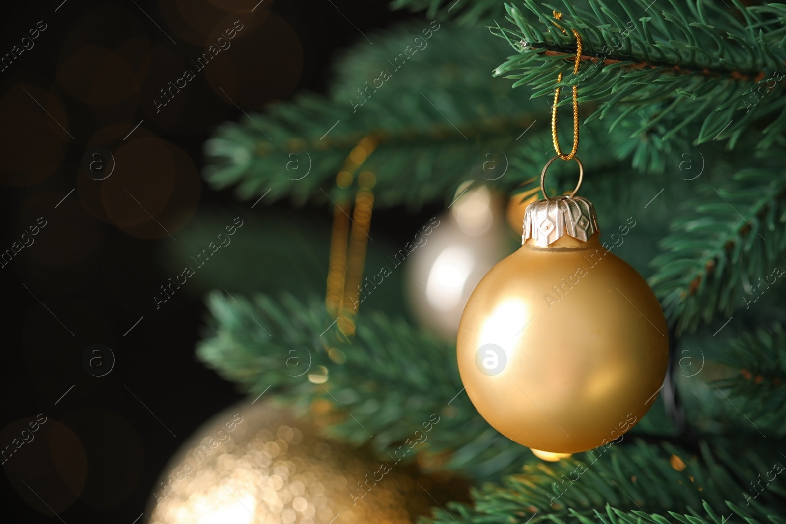 Photo of Beautiful Christmas tree with festive decor on blurred background, closeup