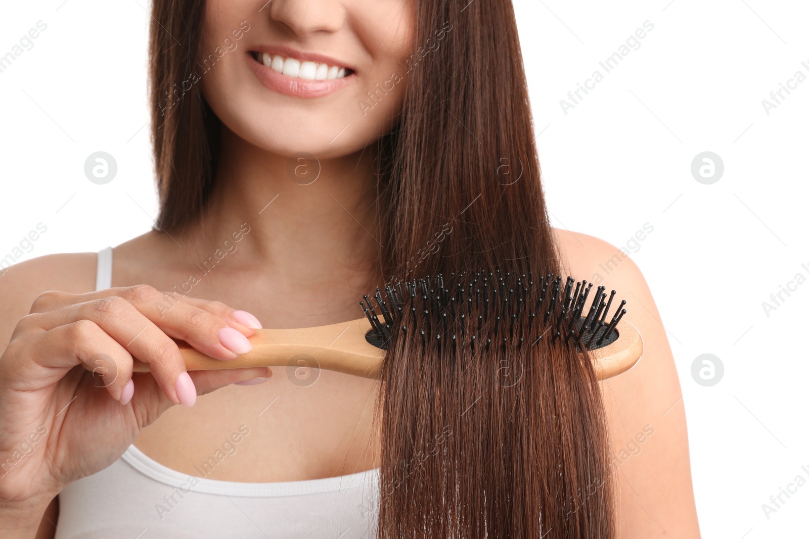 Photo of Woman with hair brush on white background, closeup