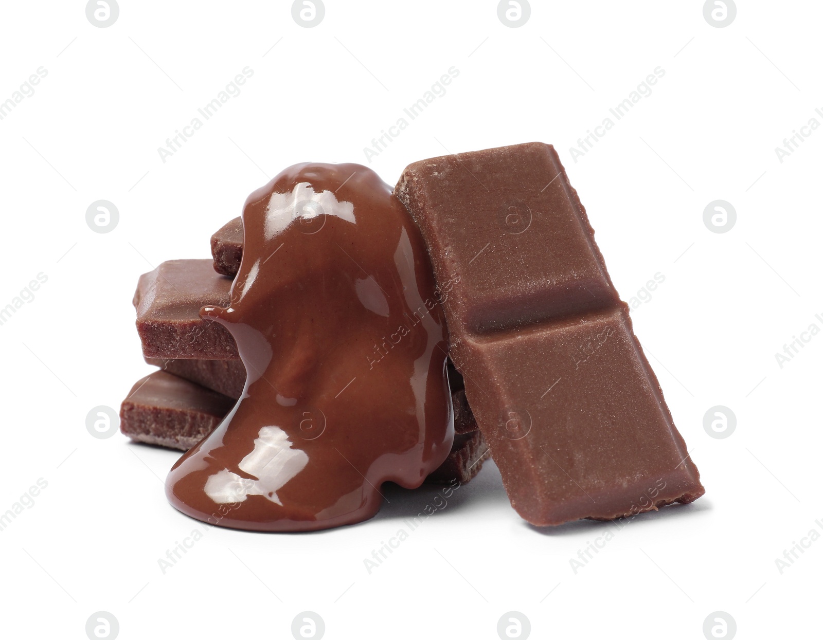 Photo of Pieces of milk chocolate with tasty paste isolated on white