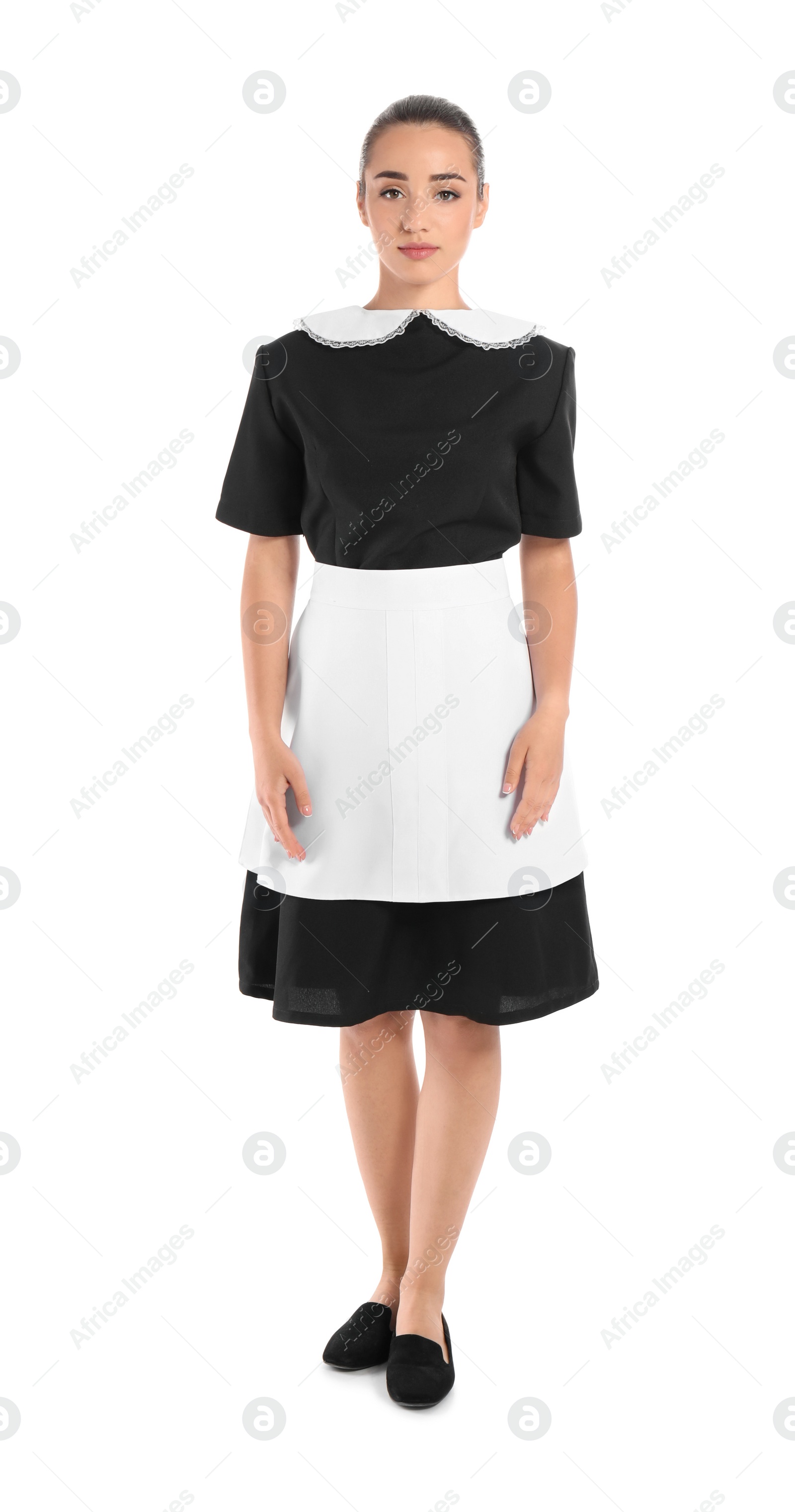 Photo of Full length portrait of young chambermaid in tidy uniform on white background