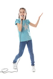 Cute girl singing in microphone on white background