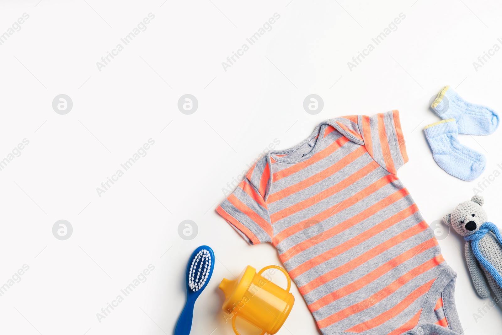 Photo of Composition with cute clothes and space for text on white background, flat lay. Baby accessories