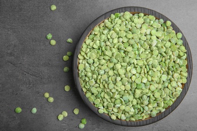 Photo of Plate with dried peas on grey background, top view