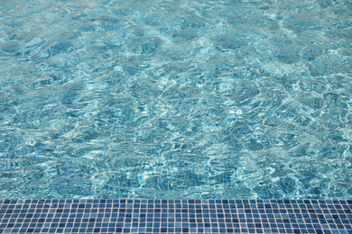 Photo of Swimming pool with clean blue water. Summer vacation