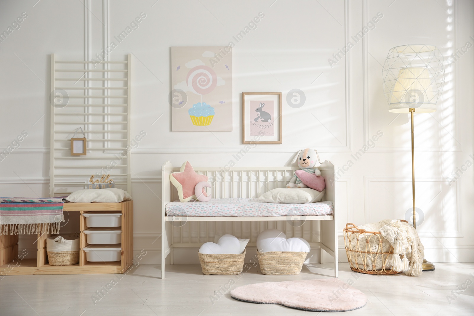 Photo of Baby room interior with stylish furniture and toys