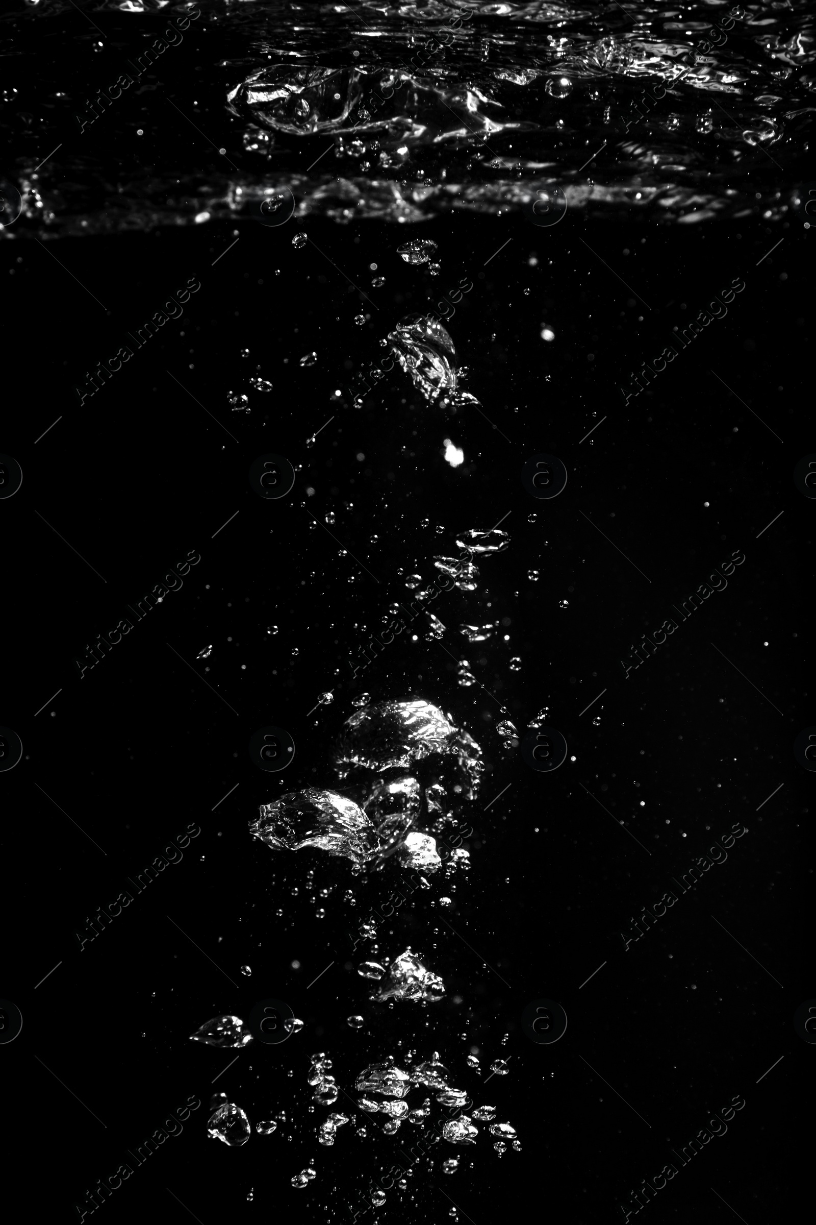 Photo of Air bubbles in water on black background